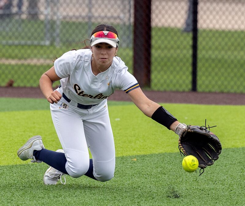Sterling’s Lily Cantu reaches for the ball in centerfield against Moline Tuesday, April 22, 2025.