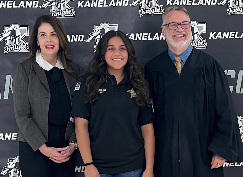 Kaneland junior Isabel Aguilera's (center) was one of six essays that won the Kane County May 1 Law Day contest, 'The Constitution’s Promise: Out of Many, One.' Kane Circuit Judges Kimberly DiGiovanni and D.J. Tegeler presented the award to her at Kaneland High School.