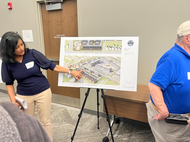 Cordogan Clark associate Viral Shah shows updated plans for the development on the former Maplewood school property on June 18, 2025 in Cary.