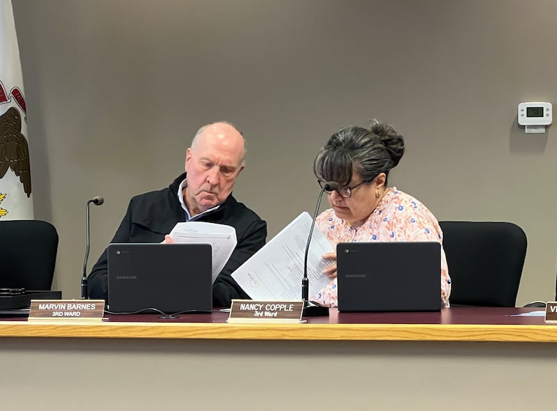 Third Ward Alderpersons Marvin Barnes and Nancy Copple look through their packets ahead of a May 18, 2026, Sycamore City Council meeting.