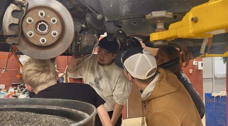 Students in the Whiteside Area Career Center's Automotive Technology program inspect the underneath of a truck on Sept. 10, 2025.