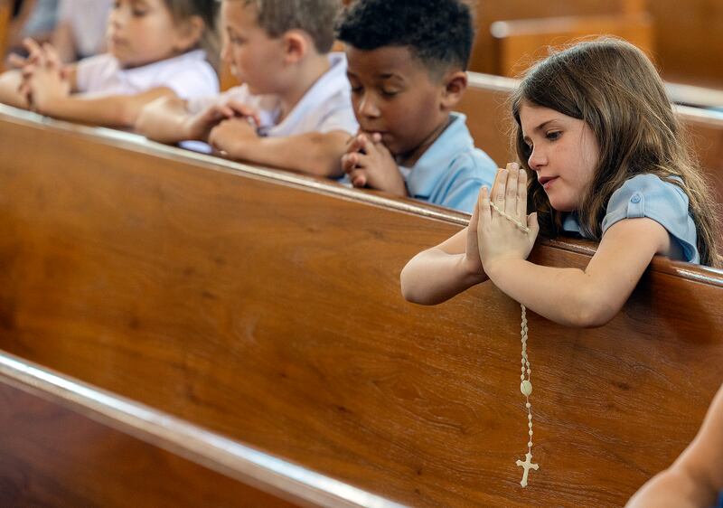 Maggie Shaddock, a student at St. Anne’s School, prays the Rosary on Wednesday, April 23, 2025, at St. Anne’s Church in Dixon. Students, staff and parishioners were invited in to pray for the recently deceased Pope Francis.