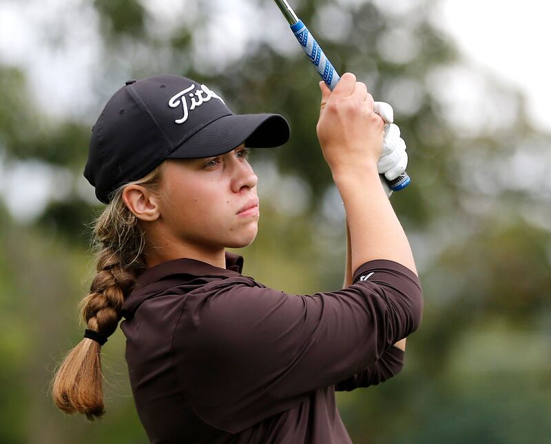 Jacobs’ Natalie Zimmerman watches her tee shot on the 13th hole during the Fox Valley Conference Girls Golf Tournament Wednesday, Sept. 24, 2025, at Crystal Woods Golf Club in Woodstock.