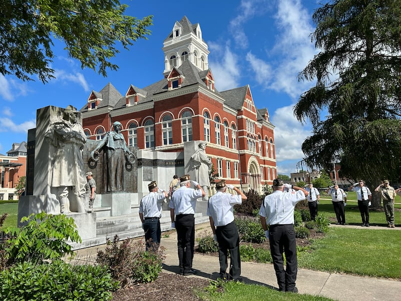 Oregon VFW members salute as two wreathes are placed on Lorado Taft's Soldier and Sailor Monument on the Ogle County Courthouse Lawn as part of Memorial Day services in Oregon on Monday, May 27, 2024.