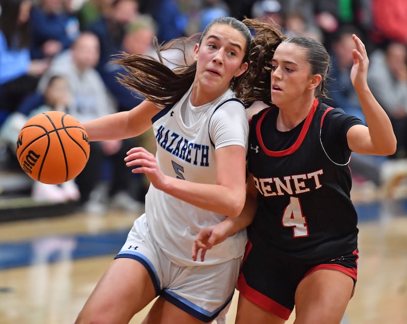 Nazareth’s Sophia Towne drives as Benet’s Ava Mersinger (4) defends during a game on December 13, 2025 at Nazareth Academy in LaGrange Park.