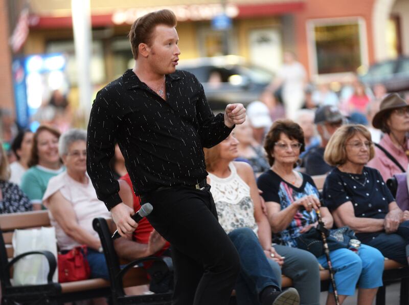 Jonny Lyons sings as he mingles with the crowd at the Mt Morris Jamboree on Friday, June 27, 2025. The Jonny Lyons and the Pride concert drew an estimated crowd of 1,000 to downtown Mt. Morris.