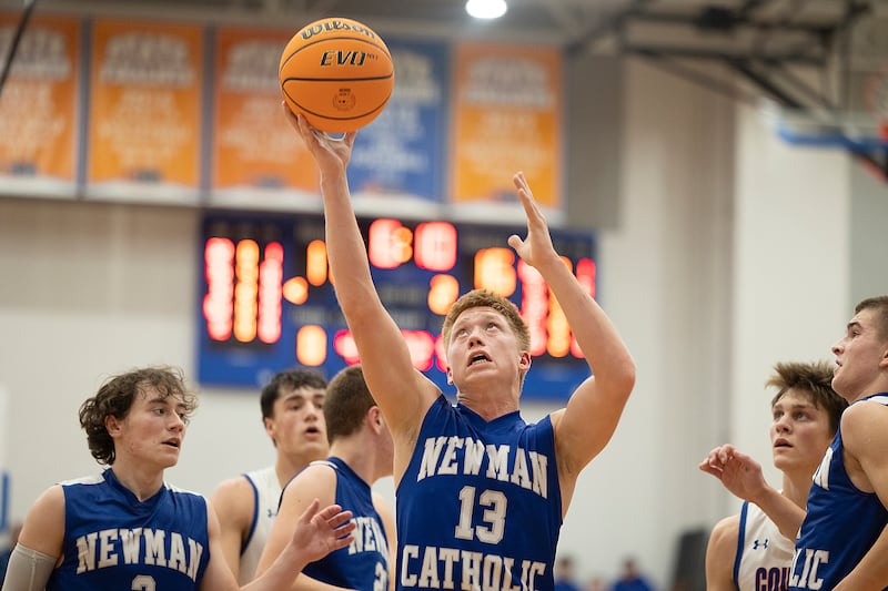 Newman’s George Jungerman pulls down a rebound against Eastland Tuesday, Dec. 10, 2024, at Eastland High School.