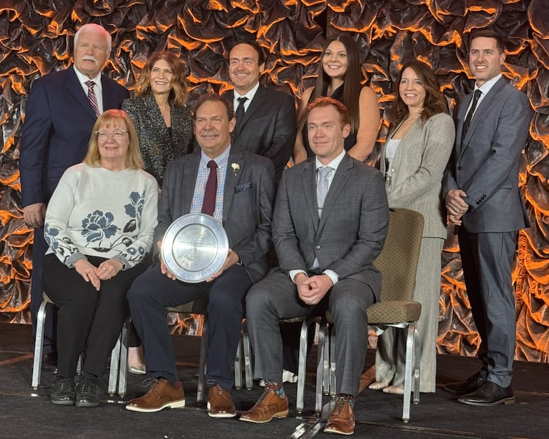 Bill McAdam, (seated, center), executive director of the Downers Grove Park District, was honored with the Robert Artz Lifetime Achievement Award by the Illinois Park and Recreation Association. McAdam is joined by member of the Downers Grove Park District board.