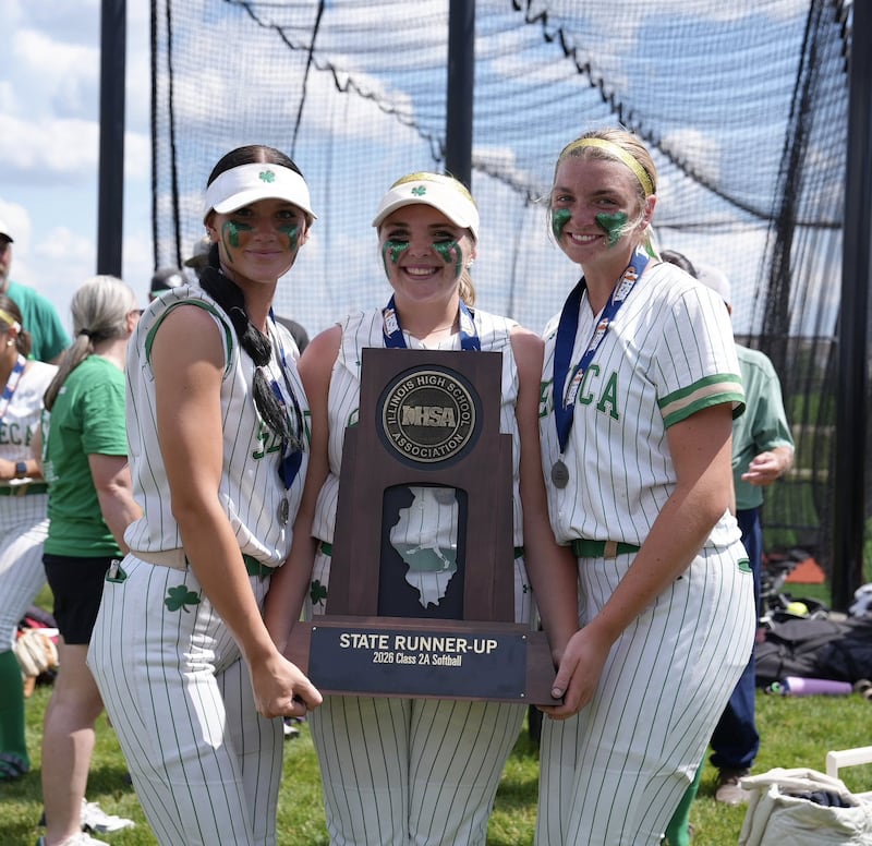 The Seneca softball team's three seniors, Lexie Buis (left), Camryn Stecken, and Tessa Krull pose with the IHSA Class 2A state second-place trophy on Saturday at the Louisville Slugger Sports Complex in Peoria.