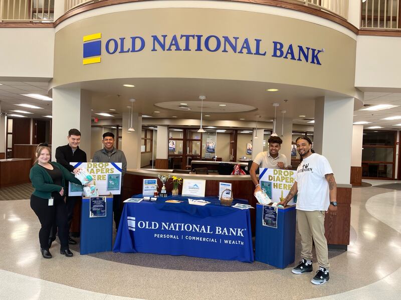 Marshall Hendricks (right) is seen in this undated photo at a drop-off location inside an Old National Bank.
