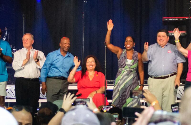 From left to right: Sen. Dick Durbin, former Secretary of State Jesse White, Sen. Tammy Duckworth, Lt. Gov. Juliana Stratton and Gov. JB Pritzker celebrate at Governor’s Day at the 2022 Illinois State Fair in Springfield.