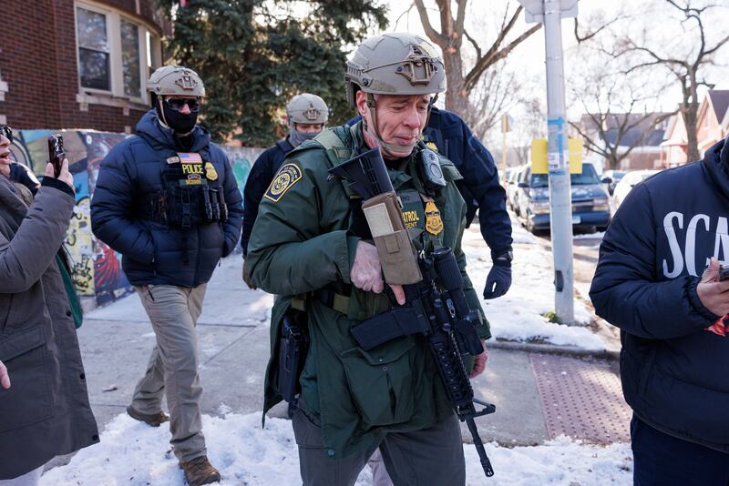Border Patrol Cmdr. Gregory Bovino walks alongside his agents after they detain an individual near West 27th Street and South Ridgeway Avenue in the Little Village neighborhood of Chicago, Tuesday, Dec. 16, 2025. (Anthony Vazquez/Chicago Sun-Times via AP)