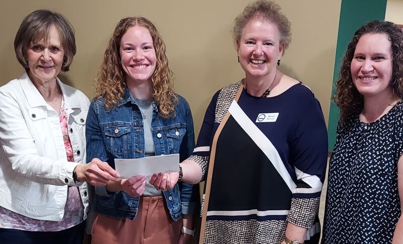 (From left): Linda Chapman, DeKalb County Retired Teachers' Association; Myranda Banister, scholarship recipient; Wendy Wiegers, Area 2 Representative; and Lora Banister, mother of Myranda, pose for a photo.