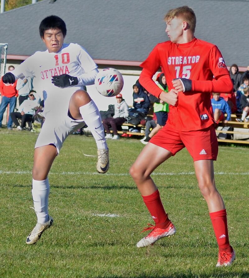 Ottawa’s Michael Bedolla and Streator’s Joe Hoekstra meet to fight for control in the first half Tuesday at Streator.