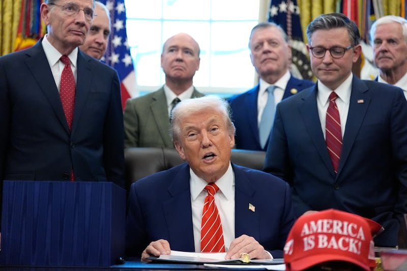 President Donald Trump speaks in the Oval Office of the White House, Tuesday, Feb. 3, 2026, in Washington, before signing a spending bill that will end a partial shutdown of the federal government. (AP Photo/Alex Brandon)