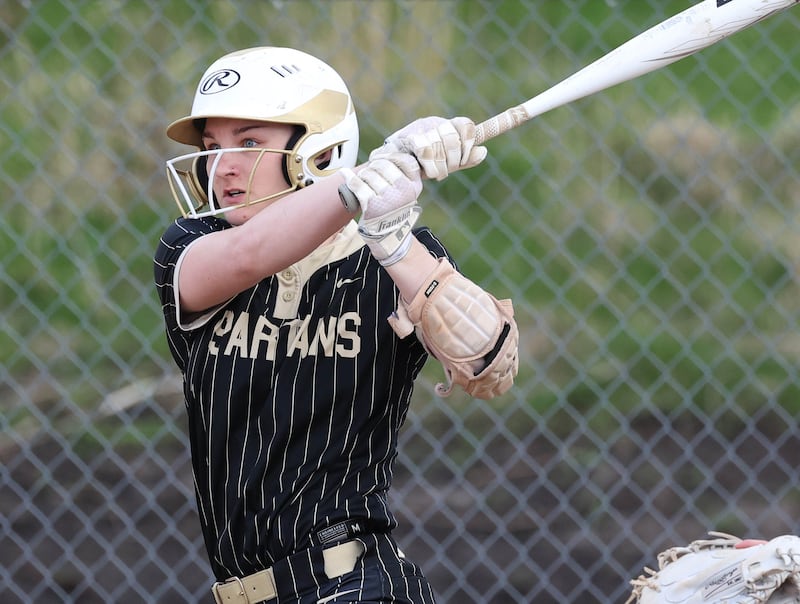 Sycamore's Ema Durst watches the ball as she singles into left field Tuesday, April 22, 2025, during their game against Kaneland at Sycamore High School.