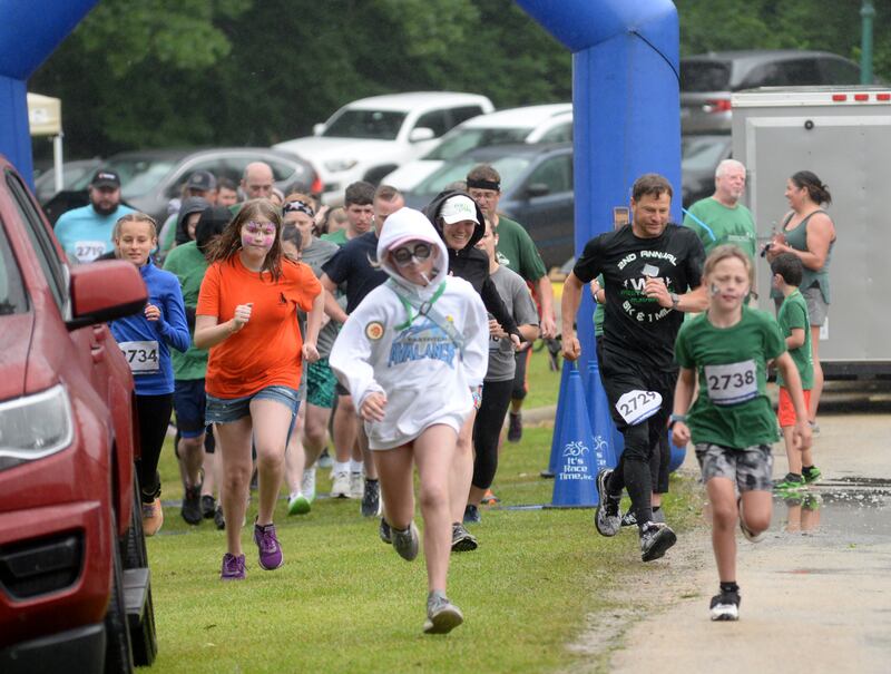 5K runners race out of the start gate at the Infinity 5K Event, held at the Rochelle Wildlife Conservation Club on Saturday, June 8, 2024.