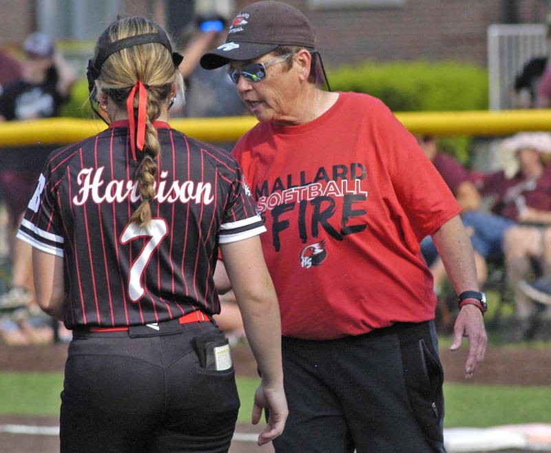 Henry-Senachwine head coach Lori Stenstrom talks with pitcher Lauren Harbison. Dakota and Henry-Senachwine softball met in Illinois Class 1A Super Sectional in Sterling on June 2, 2025. Dakota won the contest 2-0.