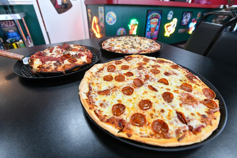 An original recipe, pepperoni pizza is joined by a tavern style and a pan pizza a Luconi's Pizza in Bradley last week during the restaurant's soft opening under the ownership of father-son duo, Howard and Rory Hertzberg.