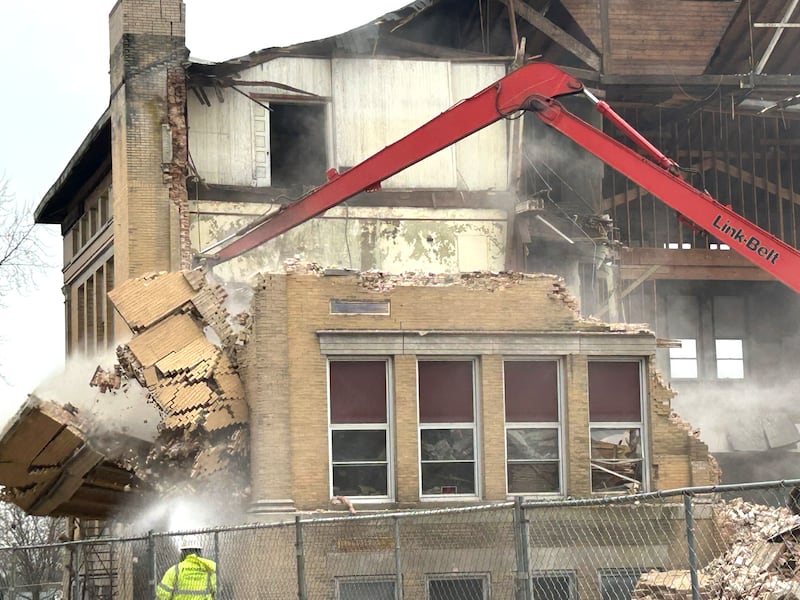 Workers from Fischer Excavating of Freeport demolish a portion of the east wall of the Congress School, 208 N. Congress Ave., on Tuesday, April 1, 2025 in Polo. Demolition of the 41,000-square-foot school built in 1899 is expected to continue this week.