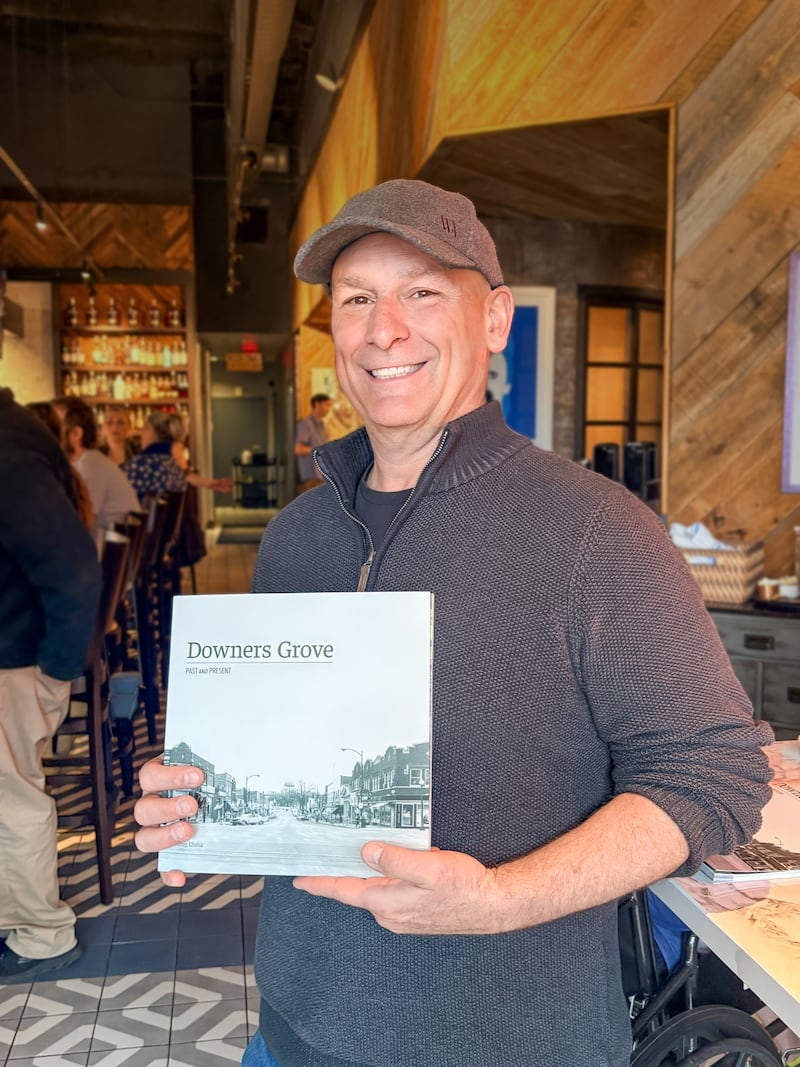 Greg Elisha's book, "Downers Grove Past and Present," features 40 side-by-side photo comparisons of the past and present locations in Downers Grove.