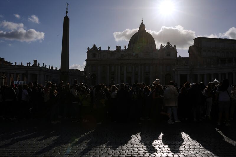 Faithful queue to pay their respect to Pope Francis lying in state inside St. Peter's Basilica, at the Vatican, Friday, April 25, 2025. (AP Photo/Francisco Seco)