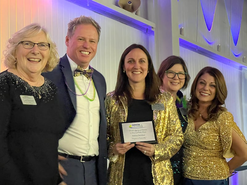 Carol Romano, Mark Carlson, Melissa Davidson, Krissy Johnson, and Cortney Strohacker stand together after Davidson was given the first-ever Legacy of Service award on Feb. 11, 2026, at the 60th annual Genoa Area Chamber of Commerce meeting and award dinner.