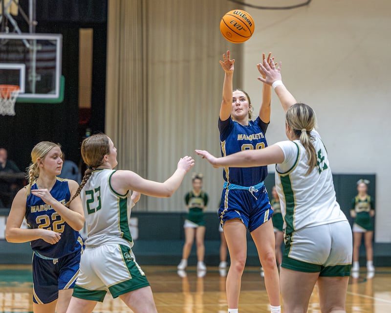 Kaitlyn Davis (20) of Marquette shoots 3-pointer as Savannah Bray (45) of St. Bede closes out on Friday, January 16, 2026 at St. Bede Academy in Peru.