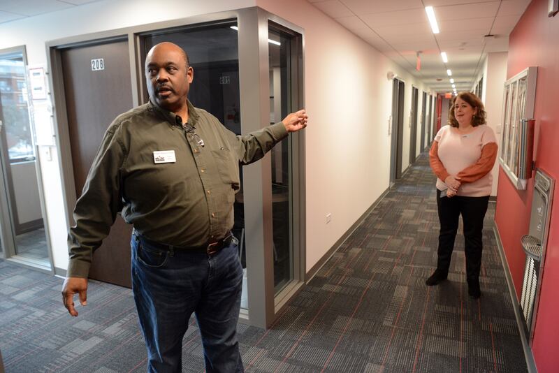 Carl Alston and Michelle Clegg talk about the meeting rooms and office space located on the second floor of the People’s Resource Center on Friday, Feb. 14, 2025 in Wheaton.