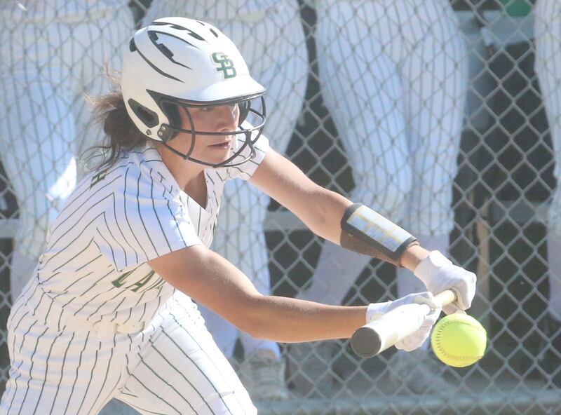 St. Bede's Lili Bosnich lays down a bunt against Midwest Central during the Class 2A Regional final on Friday, May 17, 2024 at at Abbot Phillip Davy Field.