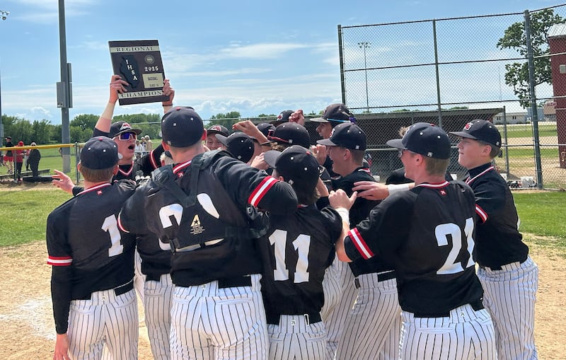 Fulton's Jacob Huisenga holds the regional trophy high in the air as he celebrates with his teammates following the Steamers' 7-4 win over Forreston at the 1A Amboy Regional on Saturday, May 24, 2025.
