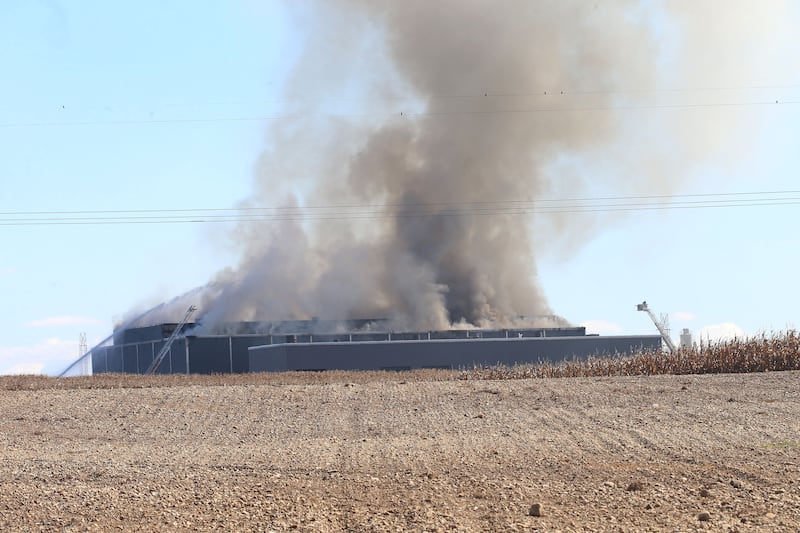 Smoke billows from Marquis Energy as firefighters work to control a structure fire on Wednesday, Oct. 8, 2025 in Hennepin. The fire was upgraded to a 5th alarm dispatching the (MABAS) Mutual Aid Box Alarm System. The fire broke out around 11a.m.