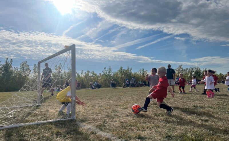 The Yorkville Parks Department’s soccer youth leagues experienced the greatest participation increase over last year’s figures. Pictured, a kindergarten player attempts to sneak a ball past the goalie at Bristol Bay Park in Yorkville.