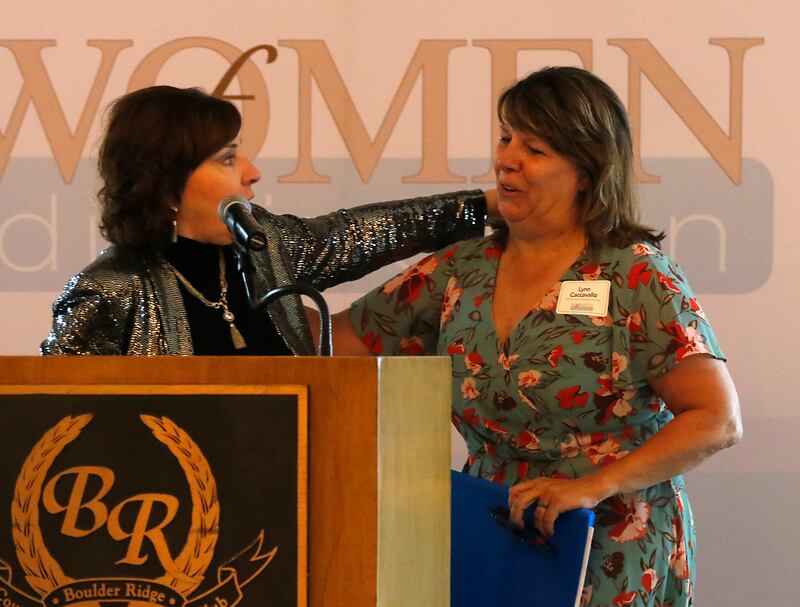Kathleen Caldwell greets award recipient Lynn Caccavallo during the Northwest Herald's Women of Distinction award luncheon Wednesday June 4, 2025, at Boulder Ridge Country Club, in Lake in the Hills. The luncheon recognized ten women in the community as Women of Distinction.
