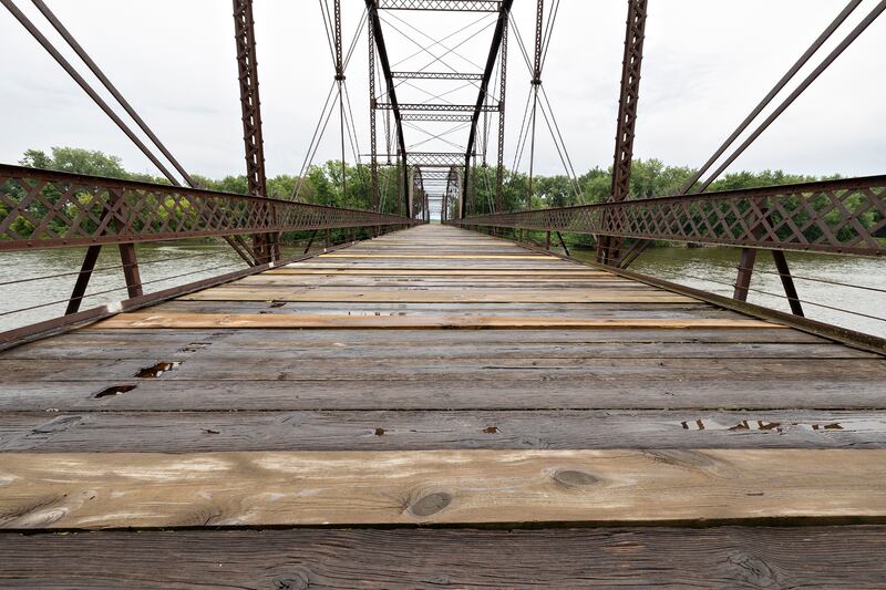 The historic Lyndon bridge is seen Thursday, July 30, 2025, spanning the Rock River. Closed in 1980, the village continues to sell plank repairs for a $100 donation with a name plate being dedicated to the donor.
