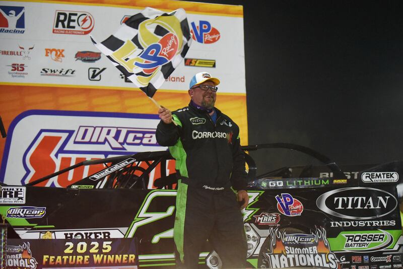 Jason Feger celebrates with the checkered flag after winning the DIRTcar late model feature race during the DIRTcar Summer Nationals at Kankakee County Speedway Wednesday, June 11, 2025.