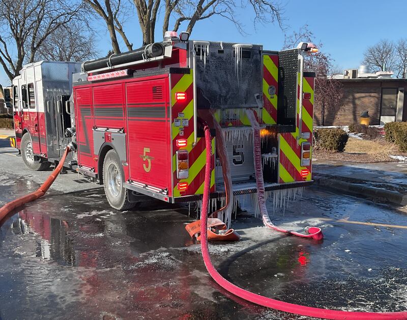 An icy Joliet Fire Department vehicle at the scene of a fire at Dirksen Junior High School on Friday, Jan. 23, 2025, in Joliet.
