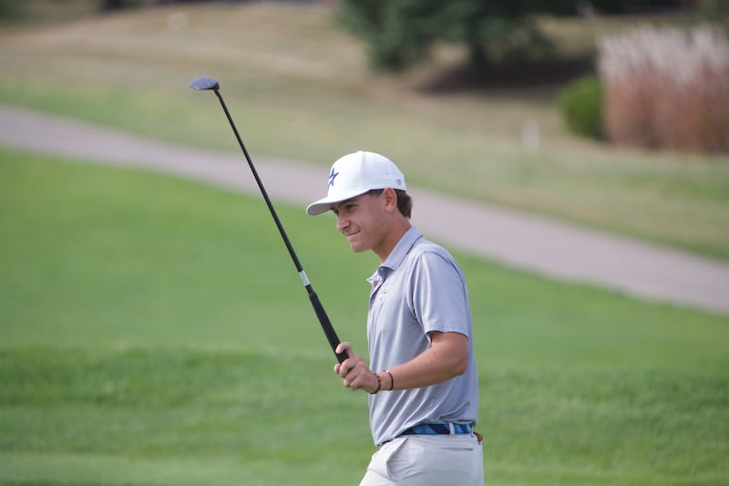 St. Charles North's Jack Van Laningham acknowledges the crowd on the 18th hole at the Class 3A St. Charles North Regional on Wednesday, Oct. 1, 2025 at Bowes Creek Country Club in Elgin.