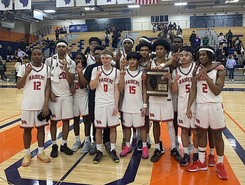 The Bolingbrook boys basketball team poses with the plaque after winning the Class 4A Oswego Regional on Friday.