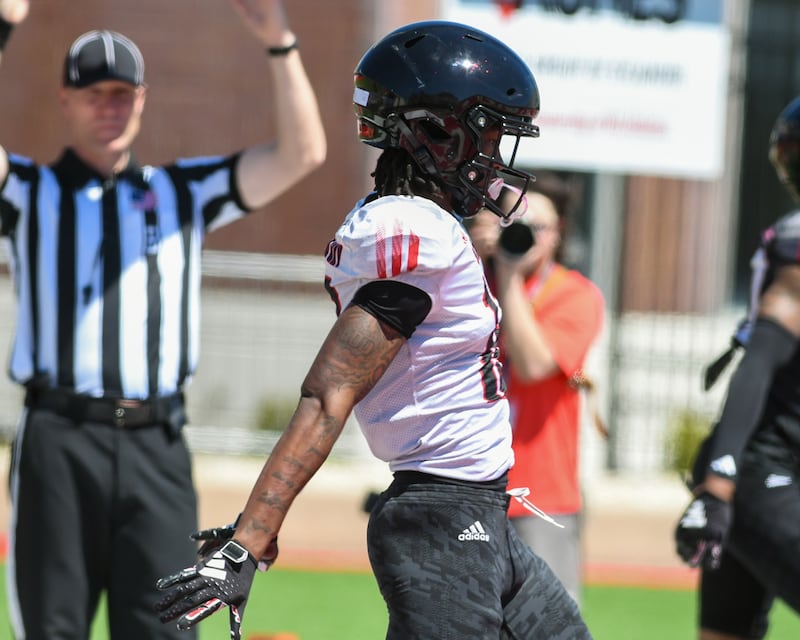 Northern Illinois University's wide receiver Tavaris Coles (12) celebrates his touchdown during the spring football scrimmage on Saturday, April 25, 2026, held at Huskie Stadium in DeKalb.