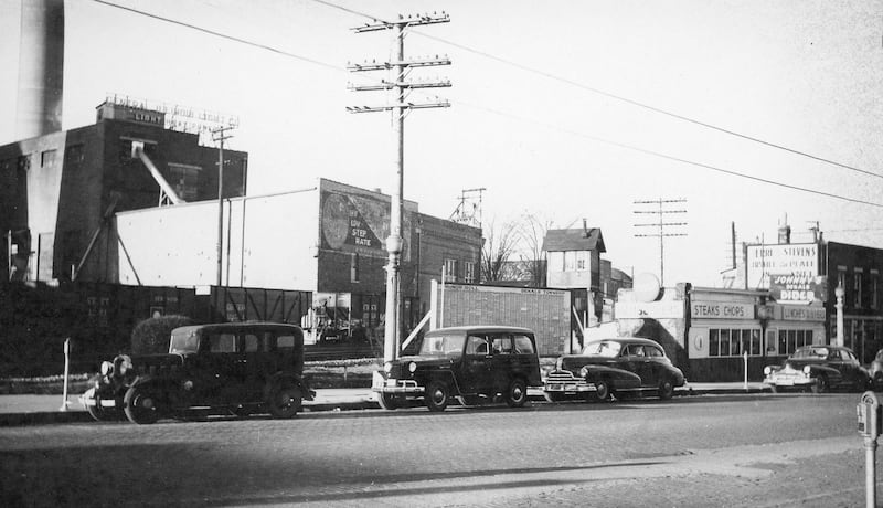 The DeKalb Township Honor Roll, looking southwest at 4th Street and Lincoln Highway in 1948. The Honor Roll listed the names of DeKalb men and women veterans who served in World War II.