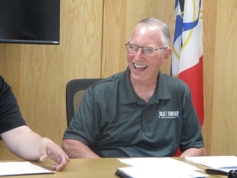 Outgoing Joliet Township Trustee Ray Slattery enjoys a moment Tuesday at his last township board meeting after 20 years of service. May 13, 2025