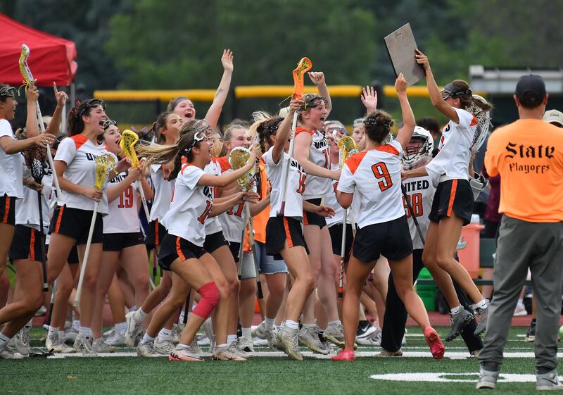 The Crystal Lake United lacrosse team celebrates upon receiving their championship plaque after the Benet Supersectional game on June 3, 2025 at College of DuPage in Glen Ellyn.
