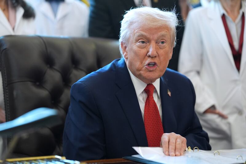 President Donald Trump speaks during an executive order signing in the Oval Office of the White House, Thursday, Dec. 18, 2025, in Washington. (AP Photo/Evan Vucci)