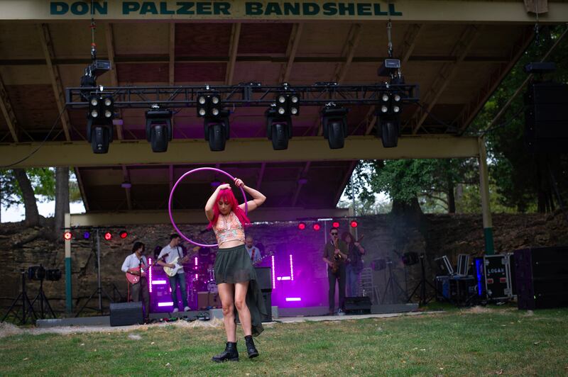 Sarah Mather, of Kankakee, performs with her hula hoop as Mateo Suarez & The Public Ear play at the Estival Festival at Bird Park in Kankakee on Saturday, September 20, 2025.