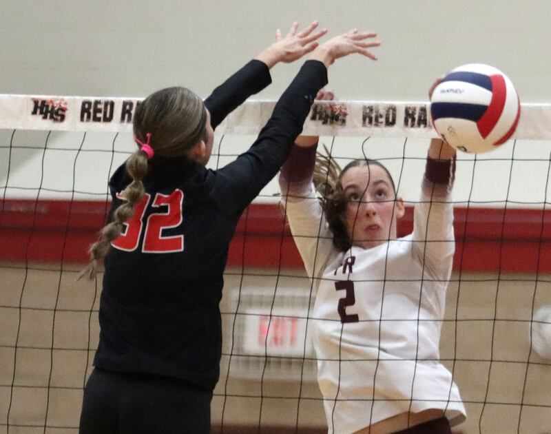 Prairie Ridge’s Addi Smith, right, battles Huntley’s Izzy Whitehouse at the net in varsity girls volleyball at Huntley High School in Huntley on Thursday, Sept. 11, 2025.