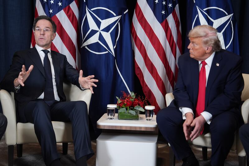 President Donald Trump, right, meets with NATO Secretary General Mark Rutte during a meeting on the sidelines of the Annual Meeting of the World Economic Forum in Davos, Switzerland, Wednesday, Jan. 21, 2026. (AP Photo/Evan Vucci)