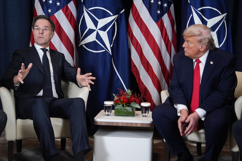 President Donald Trump, right, meets with NATO Secretary General Mark Rutte during a meeting on the sidelines of the Annual Meeting of the World Economic Forum in Davos, Switzerland, Wednesday, Jan. 21, 2026. (AP Photo/Evan Vucci)