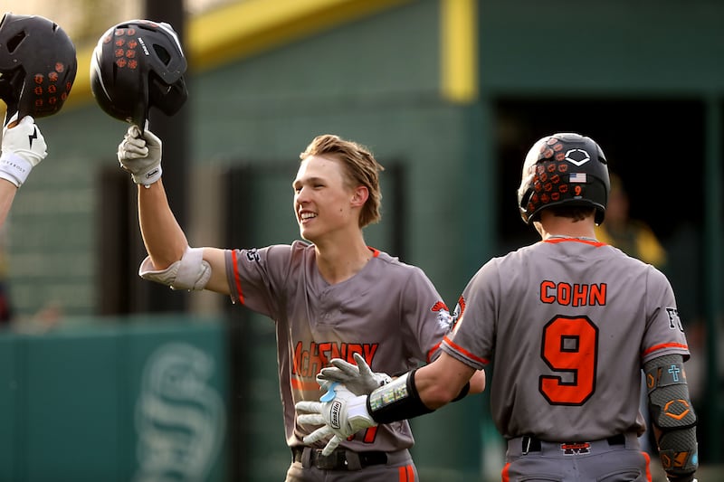 McHenry's Landon Clements celebrates his home run with teammate, Carver Cohn, during a Fox Valley Conference baseball game against Crystal Lake South on Monday, April 13, 2026, at Crystal Lake South High School.