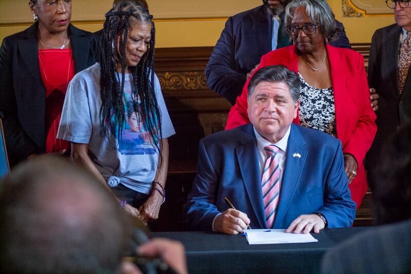 Gov. JB Pritzker signs Senate Bill 1953 into law Tuesday, Aug. 12, requiring stricter police background checks.